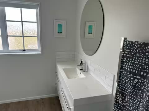 Modern bathroom shower with clean white finish