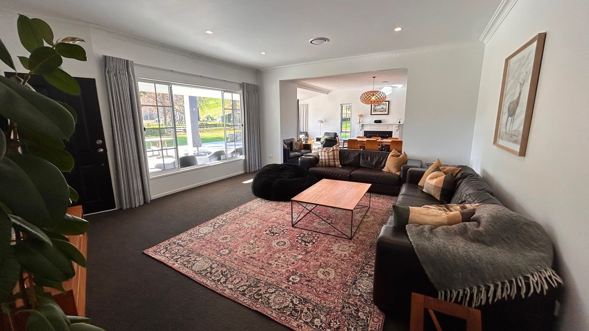 Open plan lounge flowing into dining space