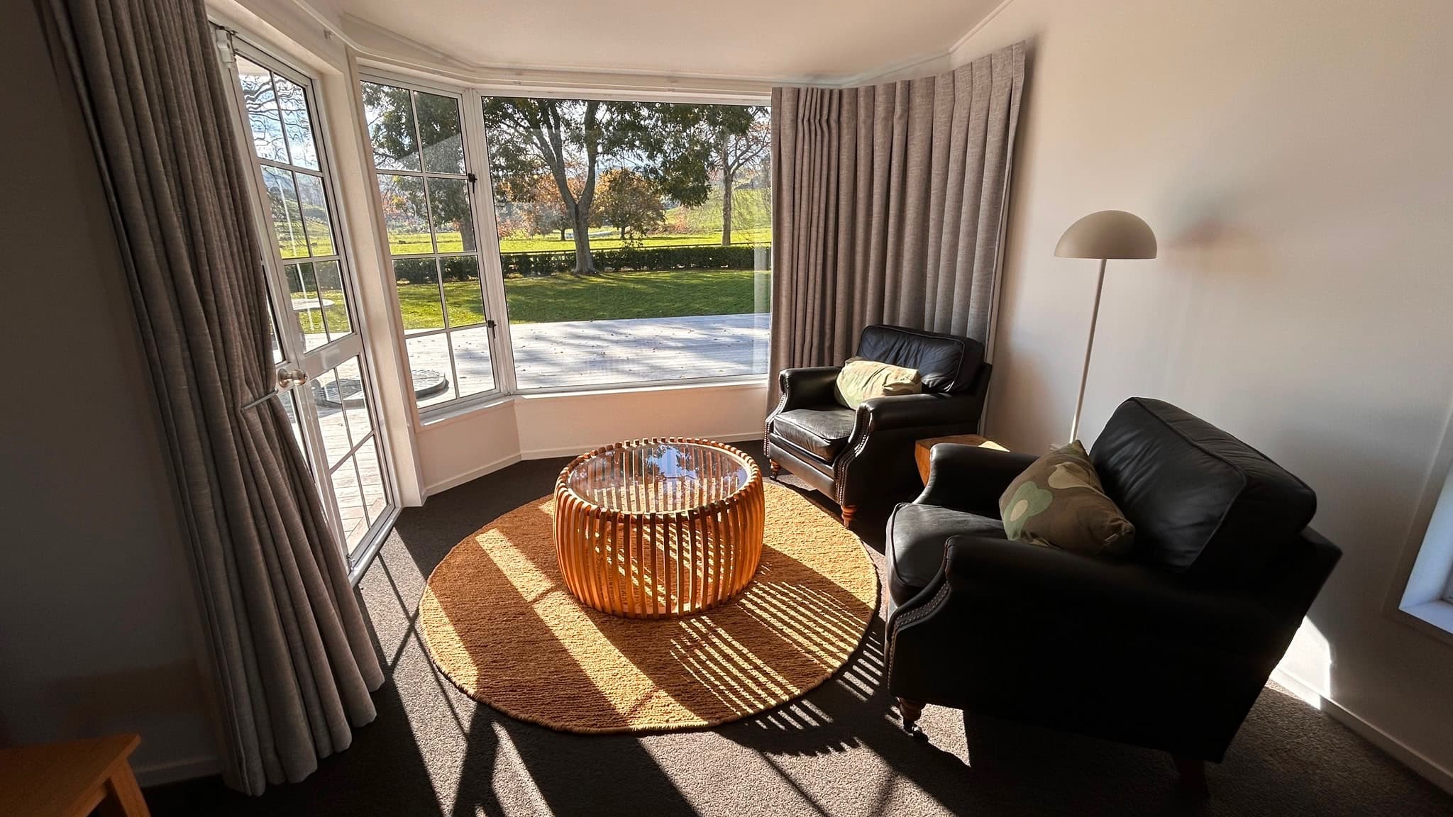 Sunlit sitting room opening to the deck
