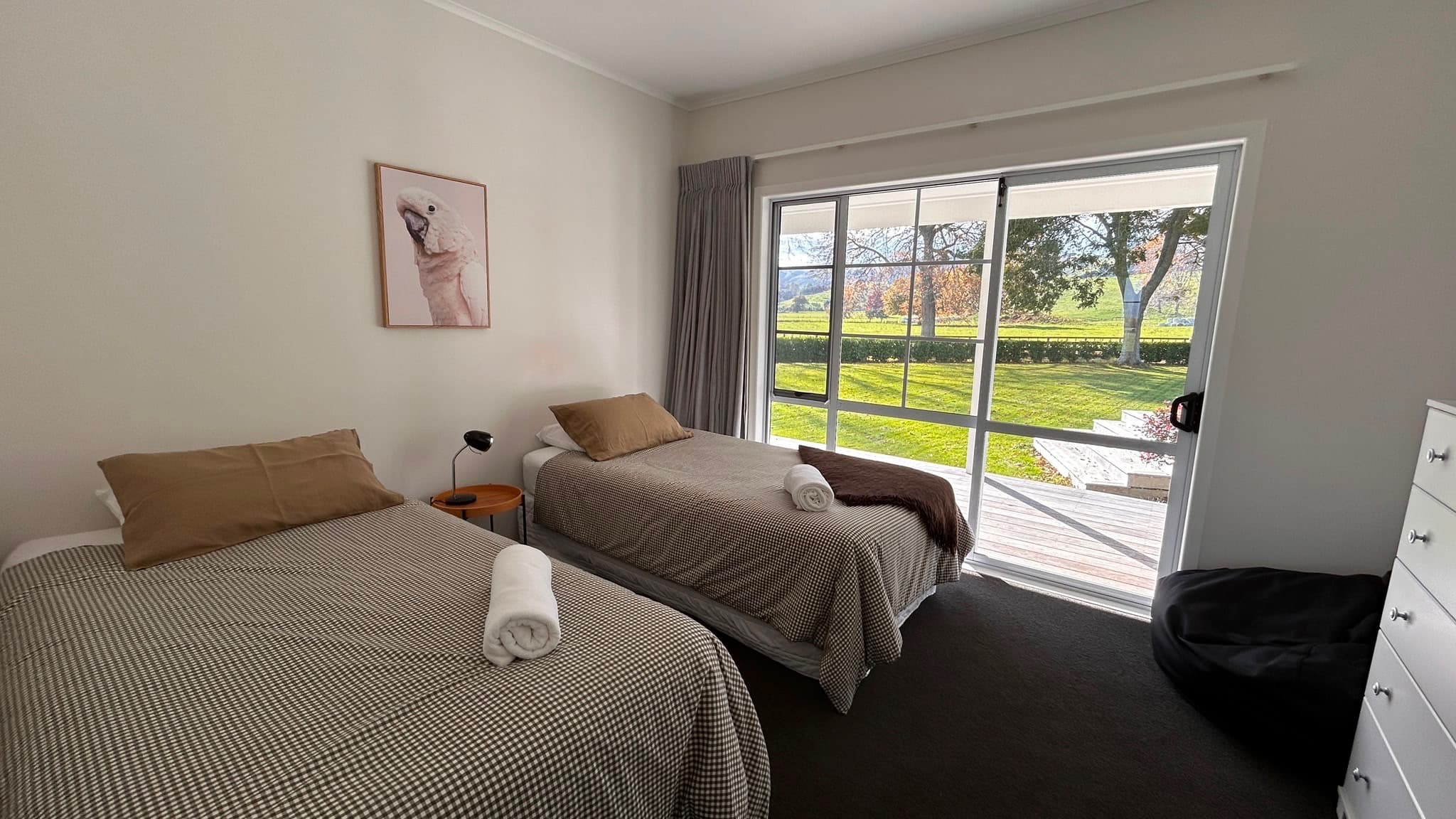 King single bedroom with two beds and deck view